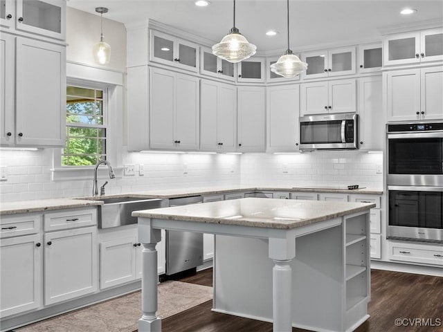 1280 Mill Quarter Rd, Powhatan, VA 23139 - kitchen featuring stainless steel appliances, white cabinetry, recessed lighting, backsplash, and a kitchen island