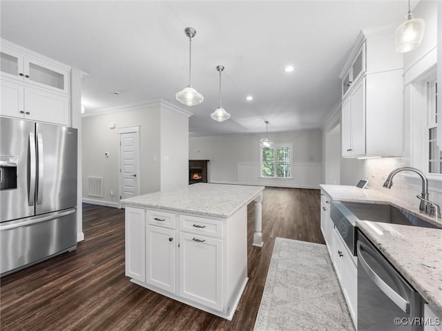 1280 Mill Quarter Rd, Powhatan, VA 23139 - kitchen featuring appliances with stainless steel finishes, dark wood-style flooring, recessed lighting, crown molding, and light stone countertops