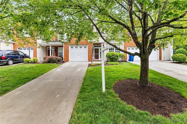 2409 Silver Lake Ter, Midlothian, VA 23112 - view of property hidden behind natural elements with concrete driveway, a front yard, brick siding, and an attached garage
