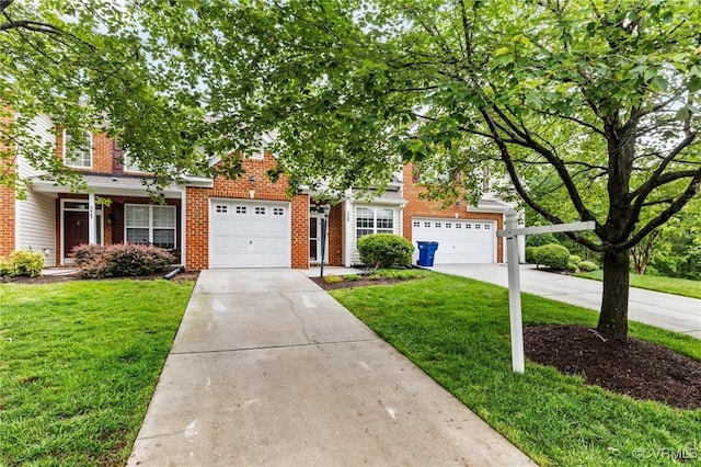 2409 Silver Lake Ter, Midlothian, VA 23112 - view of property hidden behind natural elements with driveway, a front lawn, an attached garage, and brick siding