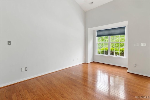 2409 Silver Lake Ter, Midlothian, VA 23112 - unfurnished room with wood finished floors, baseboards, and vaulted ceiling