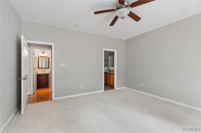 2409 Silver Lake Ter, Midlothian, VA 23112 - unfurnished bedroom with light colored carpet, ensuite bathroom, baseboards, and a ceiling fan