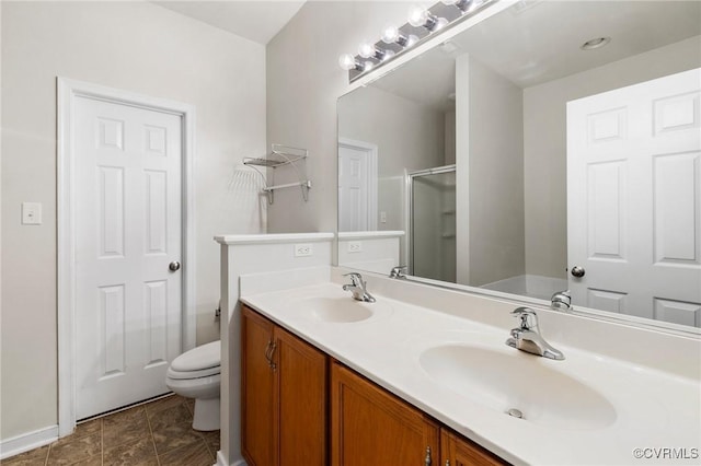 2409 Silver Lake Ter, Midlothian, VA 23112 - bathroom with a shower with shower door, double vanity, and toilet