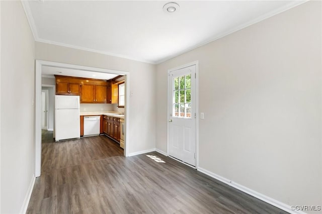 3507 Howard Rd, Henrico, VA 23223 - kitchen with white appliances, light countertops, dark wood-type flooring, baseboards, and crown molding