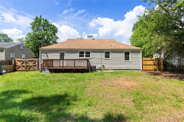 3507 Howard Rd, Henrico, VA 23223 - rear view of house with a wooden deck, a gate, and a chimney