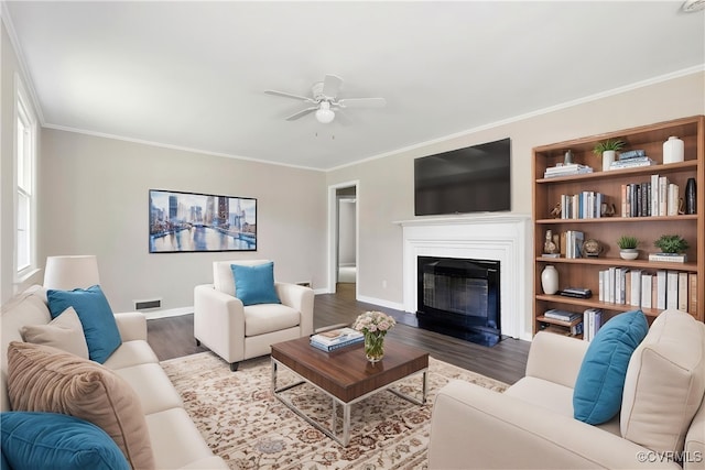 3507 Howard Rd, Henrico, VA 23223 - living area featuring ceiling fan, wood finished floors, baseboards, crown molding, and a glass covered fireplace