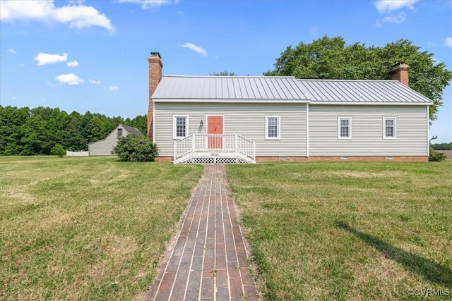 35161 Owens Grove Rd, Waverly, VA 23890 - view of front of house featuring a chimney, a front yard, crawl space, and metal roof
