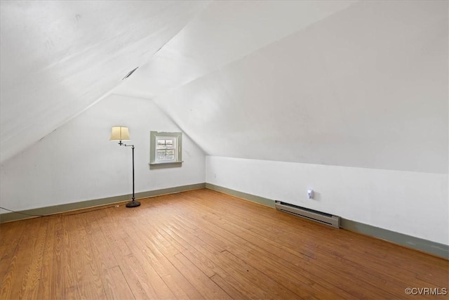 35161 Owens Grove Rd, Waverly, VA 23890 - bonus room featuring a baseboard radiator, lofted ceiling, wood-type flooring, and baseboards