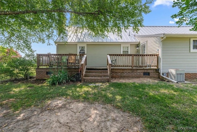 35161 Owens Grove Rd, Waverly, VA 23890 - back of property featuring a wooden deck, metal roof, a yard, and central AC unit
