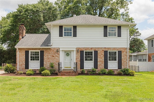 9107 Chumley Ln, Henrico, VA 23294 - view of front of house with a chimney, brick siding, and a shingled roof