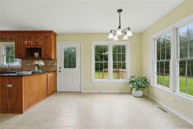 906 Dorset Rd, Powhatan, VA 23139 - kitchen featuring a chandelier, healthy amount of natural light, and dark countertops