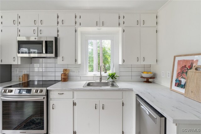 701 Nottoway Ave, Blackstone, VA 23824 - kitchen featuring appliances with stainless steel finishes, a sink, and white cabinets