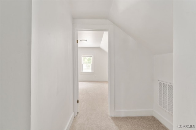 701 Nottoway Ave, Blackstone, VA 23824 - additional living space featuring vaulted ceiling, light colored carpet, and baseboards