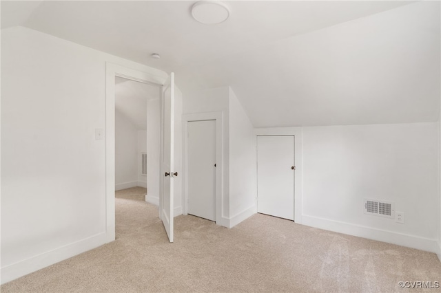 701 Nottoway Ave, Blackstone, VA 23824 - bonus room with vaulted ceiling, light colored carpet, and baseboards