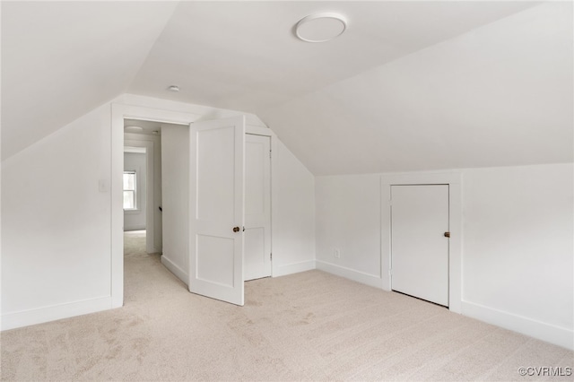 701 Nottoway Ave, Blackstone, VA 23824 - additional living space featuring light colored carpet, vaulted ceiling, and baseboards