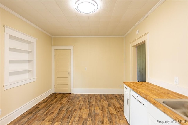 89 N Main St, Kilmarnock, VA 22482 - spare room featuring ornamental molding, dark wood finished floors, a sink, built in features, and baseboards