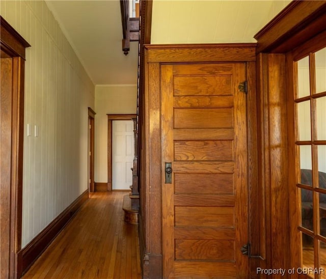 89 N Main St, Kilmarnock, VA 22482 - hall featuring dark wood-type flooring, crown molding, and baseboards