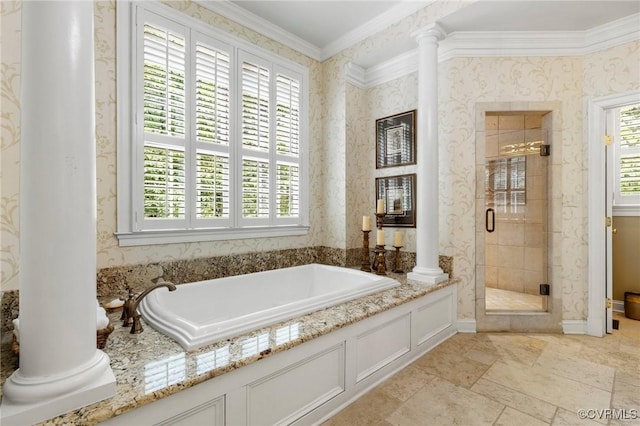 bathroom with decorative columns, healthy amount of natural light, a stall shower, and ornamental molding