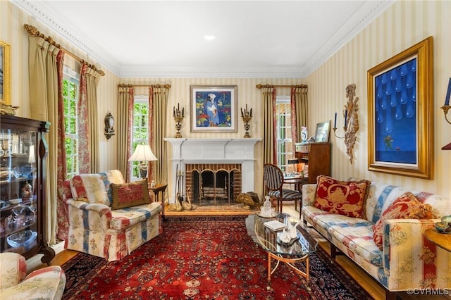 carpeted living room featuring wallpapered walls, a brick fireplace, and ornamental molding