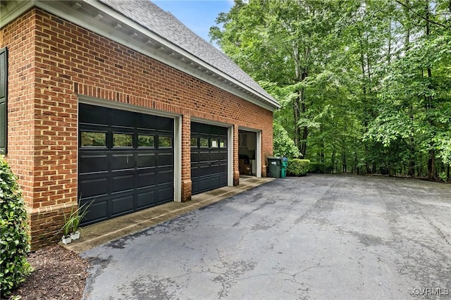 garage featuring driveway