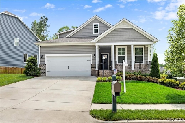 view of front of house with covered porch, brick siding, a garage, and concrete driveway