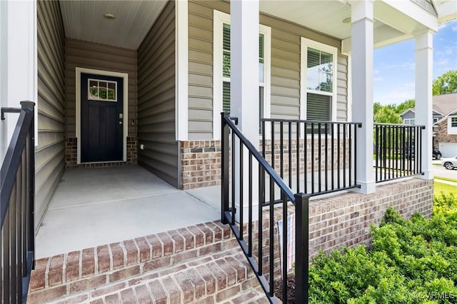 property entrance featuring covered porch