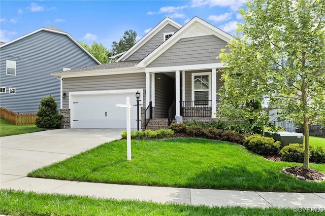craftsman-style home featuring a garage, driveway, covered porch, and brick siding