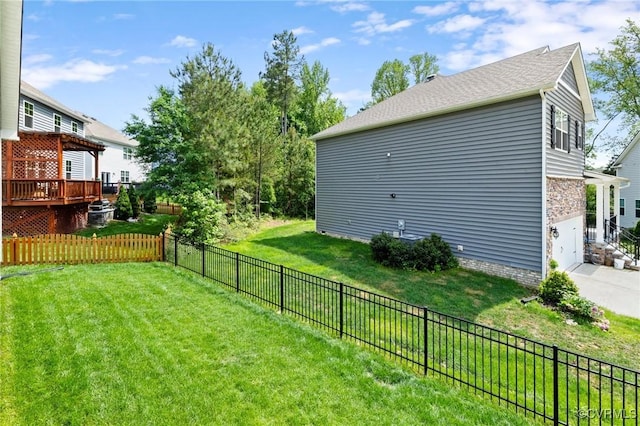 view of yard featuring a garage and a deck