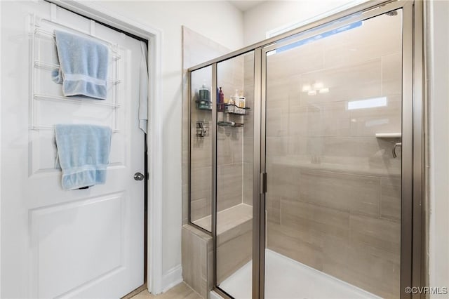 bathroom with a shower stall