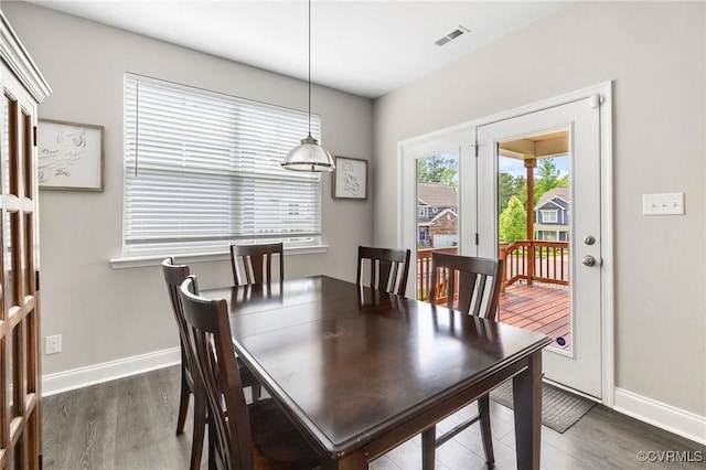 dining room with wood finished floors and baseboards
