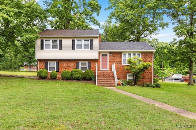 10970 Haverford Ln, North Chesterfield, VA 23236 - split level home featuring a front lawn and brick siding