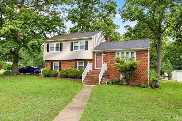 10970 Haverford Ln, North Chesterfield, VA 23236 - split level home featuring a front yard, brick siding, and a chimney