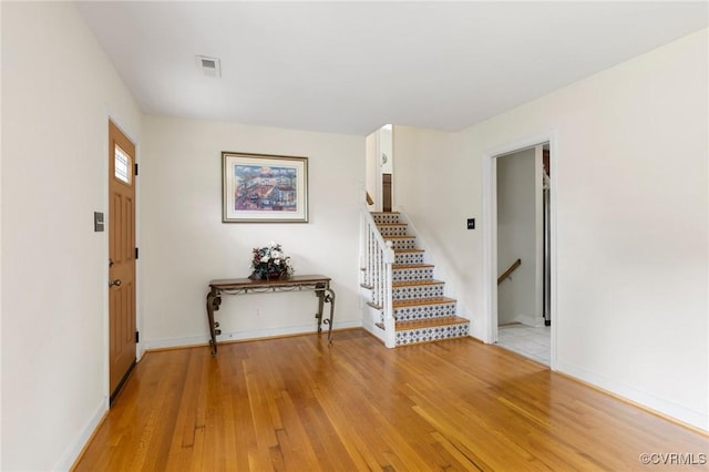 10970 Haverford Ln, North Chesterfield, VA 23236 - foyer with light wood-style floors, stairs, and baseboards