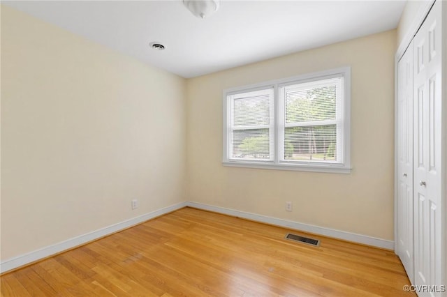 10970 Haverford Ln, North Chesterfield, VA 23236 - unfurnished bedroom with a closet, baseboards, and light wood-style floors