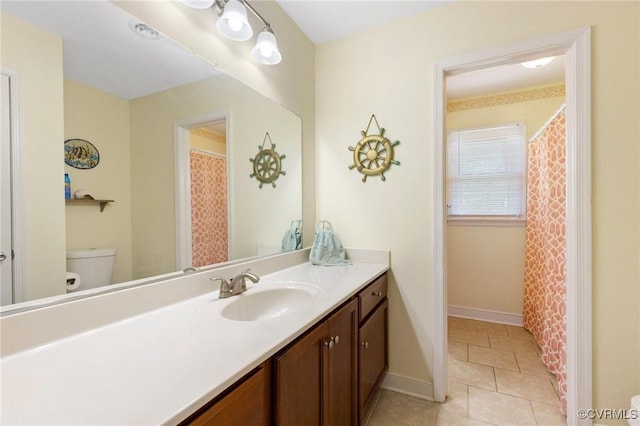 10970 Haverford Ln, North Chesterfield, VA 23236 - full bath featuring toilet, vanity, tile patterned flooring, and baseboards
