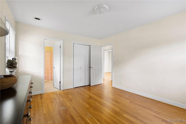 10970 Haverford Ln, North Chesterfield, VA 23236 - bedroom with baseboards, light wood-style floors, connected bathroom, and a closet