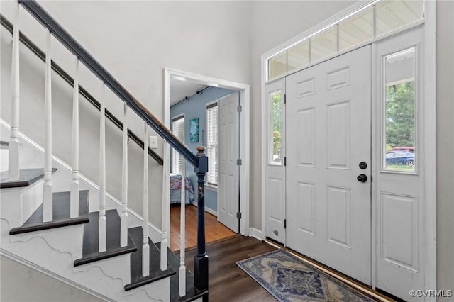 14125 Mountain Rd, Glen Allen, VA 23059 - foyer entrance with dark wood-type flooring, stairway, and baseboards