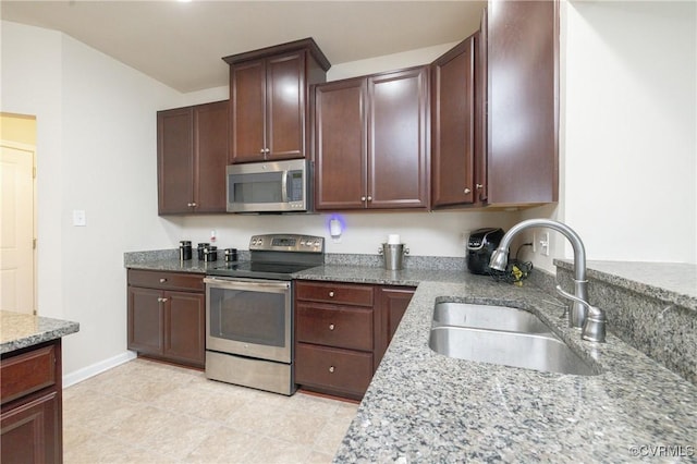 9006 Proctors Run Ct, Chesterfield, VA 23237 - kitchen featuring appliances with stainless steel finishes, a sink, light stone counters, dark brown cabinets, and baseboards