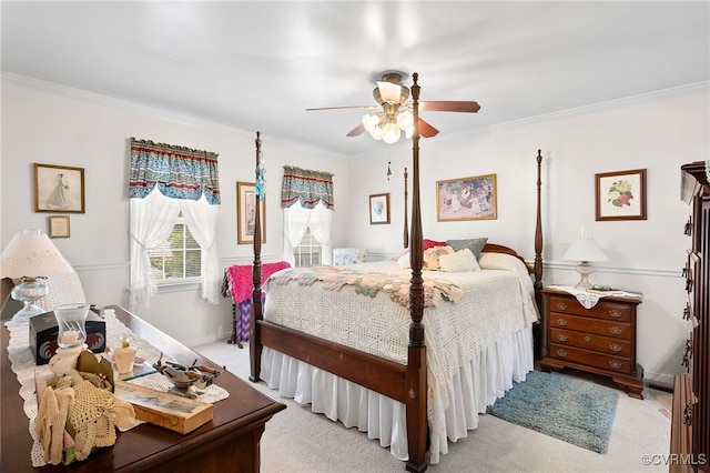 bedroom featuring ornamental molding, ceiling fan, baseboards, and light colored carpet