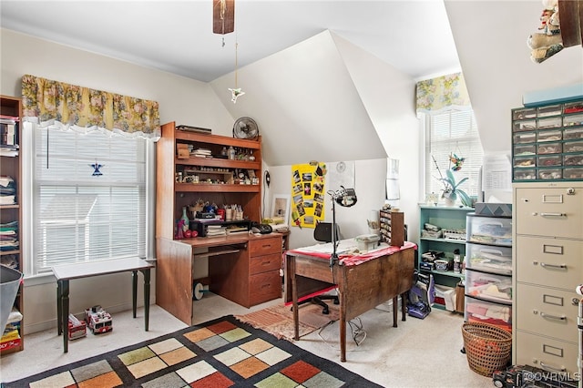 home office with carpet floors, lofted ceiling, and ceiling fan