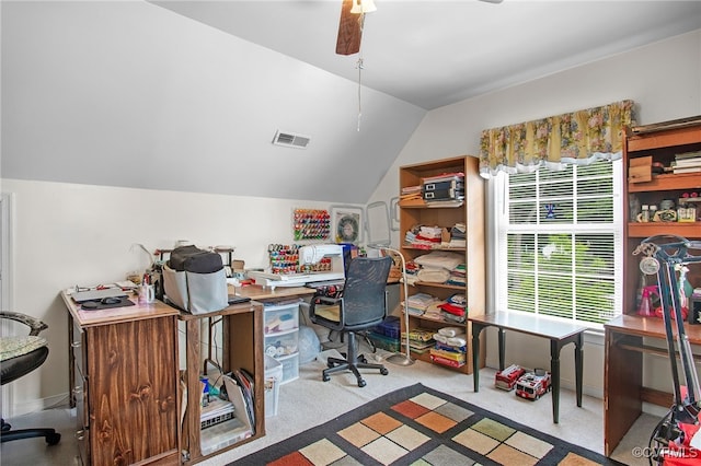 office area featuring lofted ceiling, carpet floors, and ceiling fan