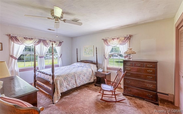 68 Family Ln, Cobbs Creek, VA 23035 - bedroom with carpet flooring, ceiling fan, and baseboard heating