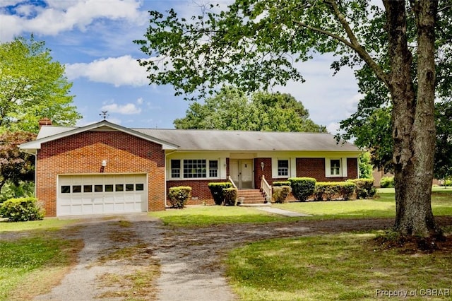 68 Family Ln, Cobbs Creek, VA 23035 - single story home with dirt driveway, brick siding, a garage, and a front lawn