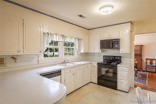 68 Family Ln, Cobbs Creek, VA 23035 - kitchen featuring black appliances, a sink, light countertops, and decorative backsplash