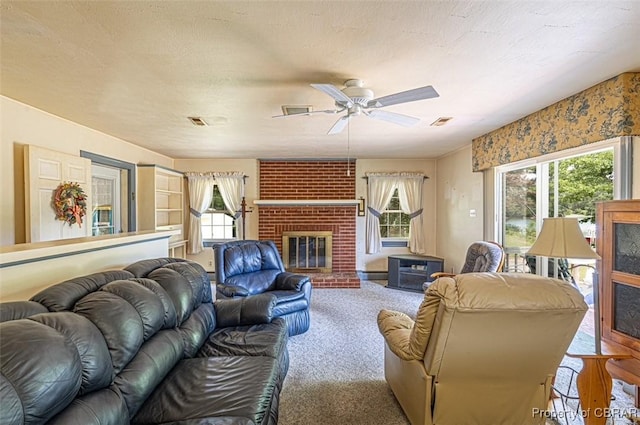 68 Family Ln, Cobbs Creek, VA 23035 - carpeted living area with a brick fireplace and a ceiling fan