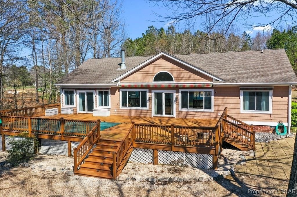 678 Wheatland Acres Rd, Lottsburg, VA 22511 - back of property featuring roof with shingles, stairs, and a wooden deck