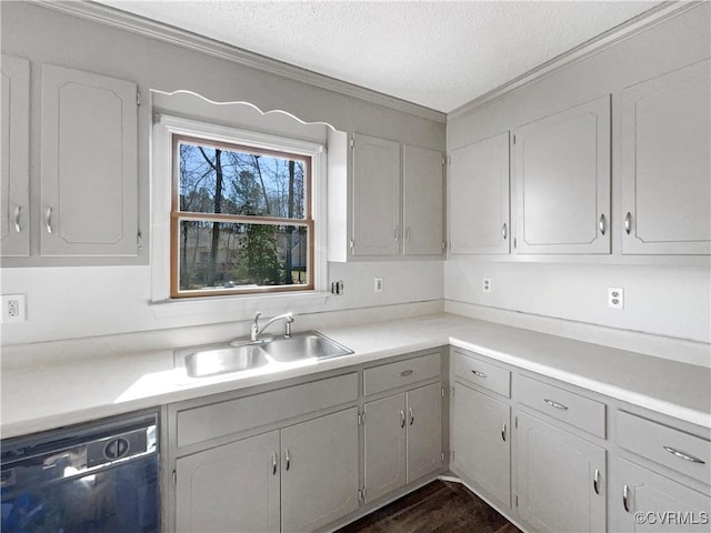kitchen featuring black dishwasher, a sink, a textured ceiling, ornamental molding, and light countertops