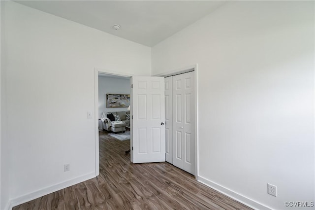 314 Maryland Ave, Hopewell, VA 23860 - unfurnished bedroom featuring baseboards, wood finished floors, and a closet
