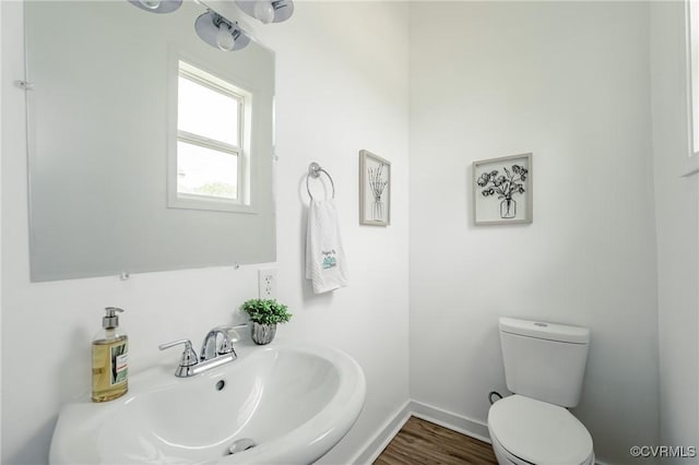 314 Maryland Ave, Hopewell, VA 23860 - bathroom featuring a sink, toilet, baseboards, and wood finished floors