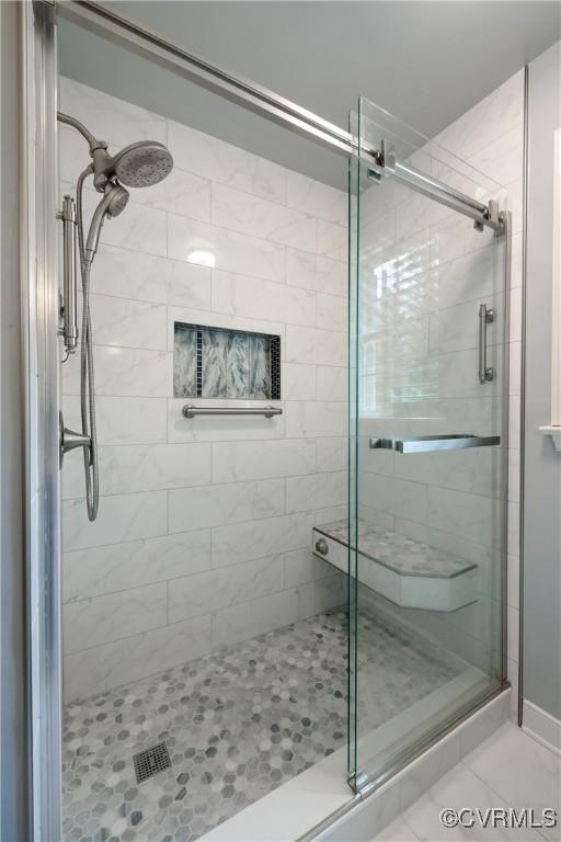 bathroom featuring a stall shower and tile patterned floors